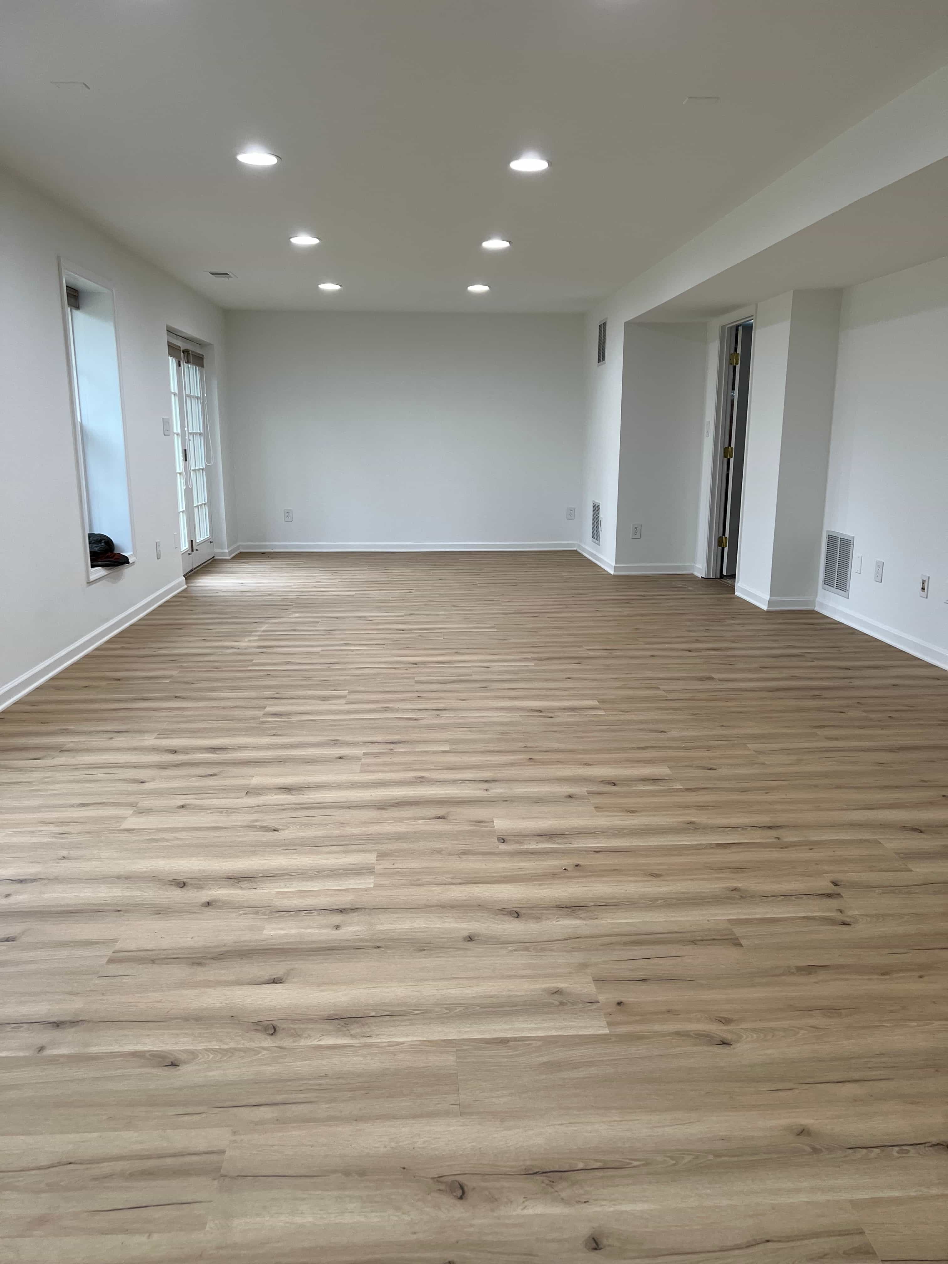 Light wood floor in finished basement.